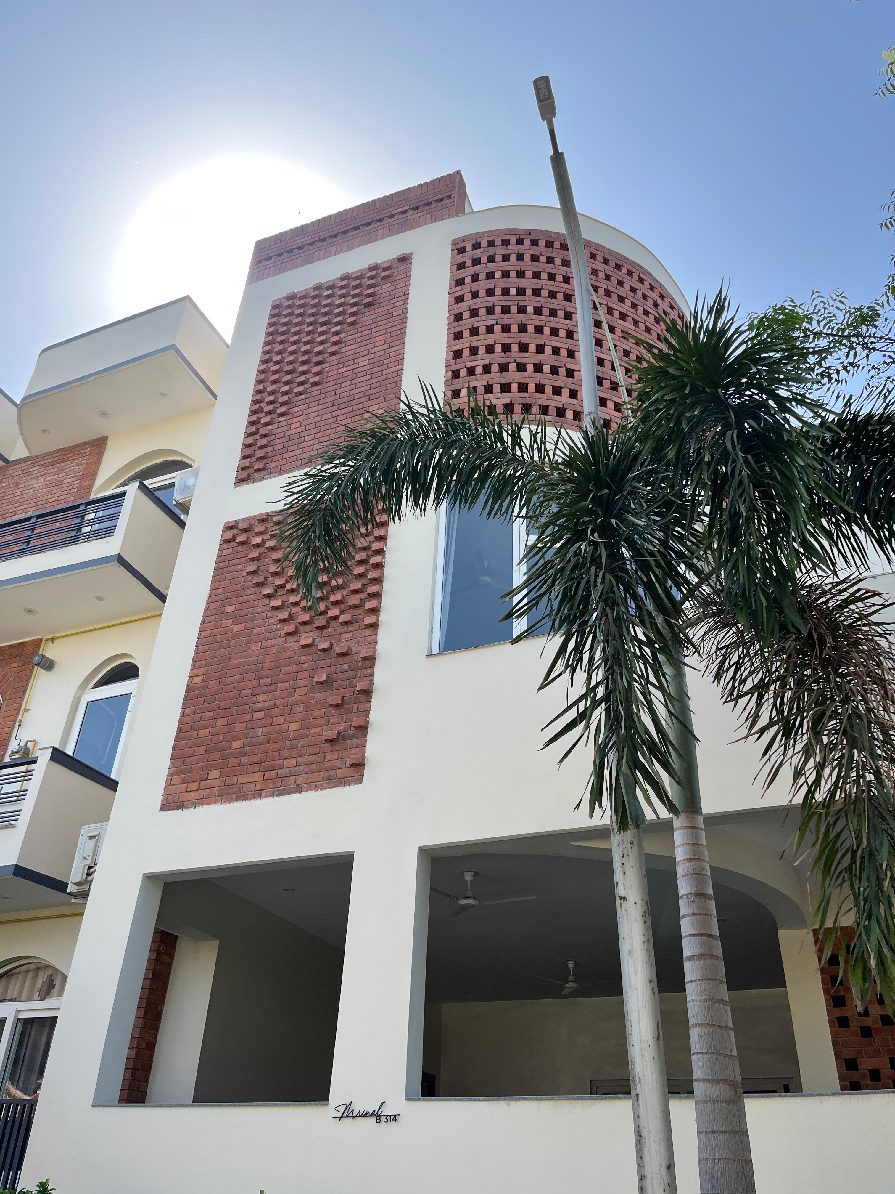 Completed residential building with exposed wire cut brick — Bricks Street
